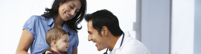 Pediatrician in consultation with mother and baby